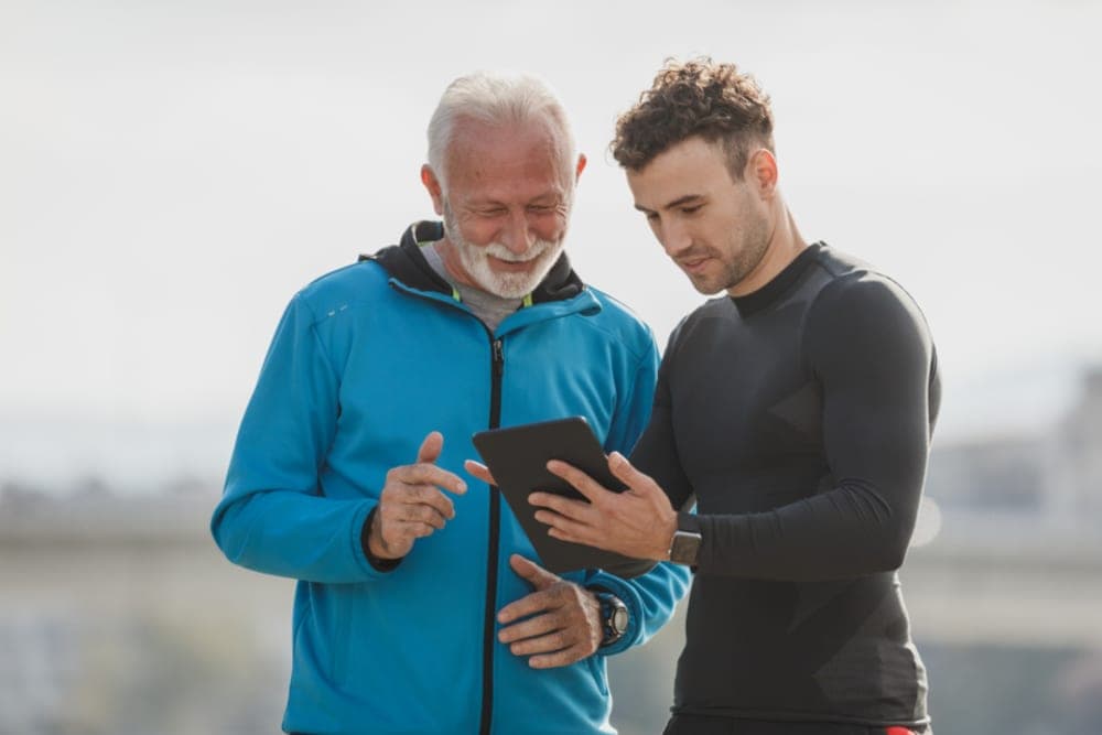 Two people going through a tablet together